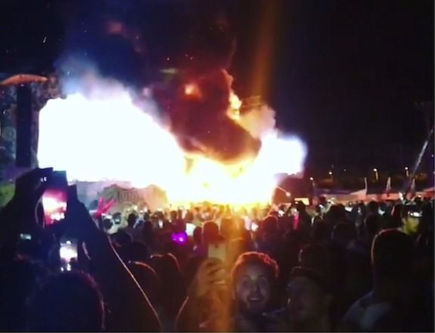Police say more than 22 thousand fans were evacuated after a fire started on a stage at the Tomorrowland music festival in Barcelona.