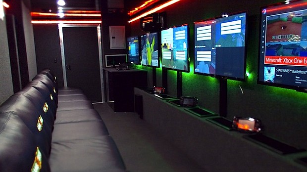 	This photograph shows the interior of one of Gametruck's video game trailers.