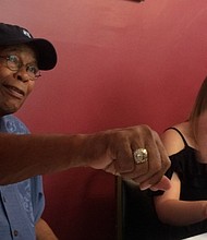 Rod Carew fist bumps one of his many well-wishers during Hall of Fame weekend.