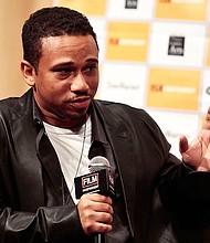 Photo of McGruder in 2012 by Tibrina Hobson