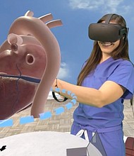 Alyssa Giacalone, a physician assistant at Lucile Packard Children’s Hospital Stanford, uses the Stanford Virtual Heart. (Photo courtesy of David Sarno)