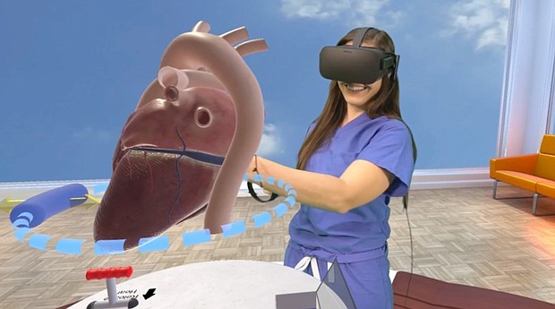 Alyssa Giacalone, a physician assistant at Lucile Packard Children’s Hospital Stanford, uses the Stanford Virtual Heart. (Photo courtesy of David Sarno)