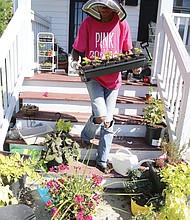 Cityscape // Ms. Burton, who said she suffers from chronic health issues, calls working in the garden “my therapy.” She finds peace when her hands are planting, weeding or working the soil. 