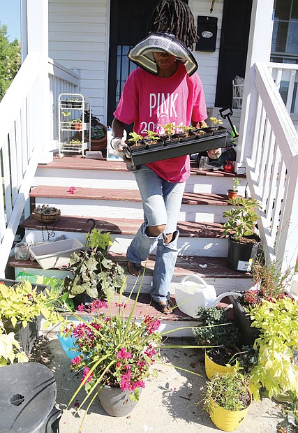 Cityscape // Ms. Burton, who said she suffers from chronic health issues, calls working in the garden “my therapy.” She finds peace when her hands are planting, weeding or working the soil. 