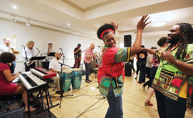 The RVA Latino experience//Judy Lynn Edwards and Kevin LaMarr Jones of Richmond take the floor and party to the beat during the day’s festivities. 