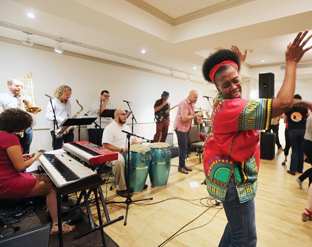 The RVA Latino experience//Judy Lynn Edwards and Kevin LaMarr Jones of Richmond take the floor and party to the beat during the day’s festivities. 