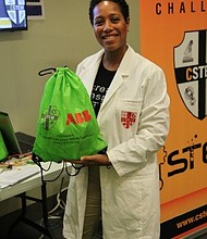 Dr. Reagan Flowers holding up one of the bags given to the kids
who participated in the “C-STEM Summer Pop-Up Maker Space Camp.” (Photo: The Health Museum)