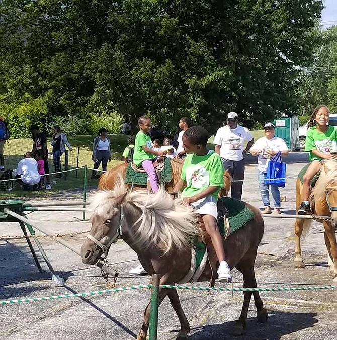 Alderman Carrie Austin of the 34th Ward collaborated with Phalanx Family Services and hosted a back-to-school festival on July 28, 2017, and provided 1,000 area youth with needed school supplies. Students and their families participated in various activities including free lunches, riding horses, and obtaining job opportunity information at Universal Entertainment Center, location 11901 S. Loomis. Photo Credit: Christopher Shuttlesworth