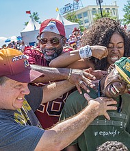 Fans of all ages turned out for the event that included a good-natured drubbing of a Green Bay Packers fan who was dressed showing his allegiance.