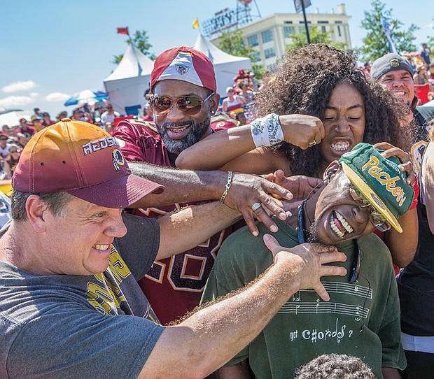 Fans of all ages turned out for the event that included a good-natured drubbing of a Green Bay Packers fan who was dressed showing his allegiance.