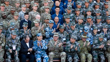 Top US and Chinese military commanders signed a deal in Beijing Tuesday to improve communications between the two forces amid …