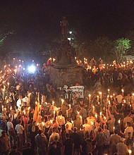 White nationalists march with torches in a Nazi-style parade Friday night on the University of Virginia campus. The torch-lit event took place on the eve of the larger “Unite the Right” rally in the city of Charlottesville protesting the planned removal of a statue of Confederate Gen. Robert E. Lee. 