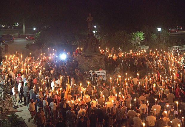 White nationalists march with torches in a Nazi-style parade Friday night on the University of Virginia campus. The torch-lit event took place on the eve of the larger “Unite the Right” rally in the city of Charlottesville protesting the planned removal of a statue of Confederate Gen. Robert E. Lee. 