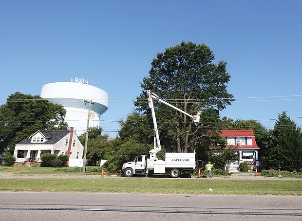 He said the company has nine trucks in operation and trims trees in the Richmond area on a three-year cycle. This work was taking place in the 2300 block of Broad Rock Boulevard in South Side.