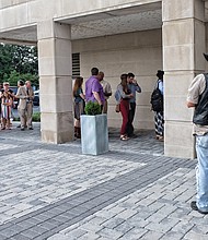 People line up outside the Virginia Historical Society for the Aug. 9 public hearing on the Confederate statues along Monument Avenue.
