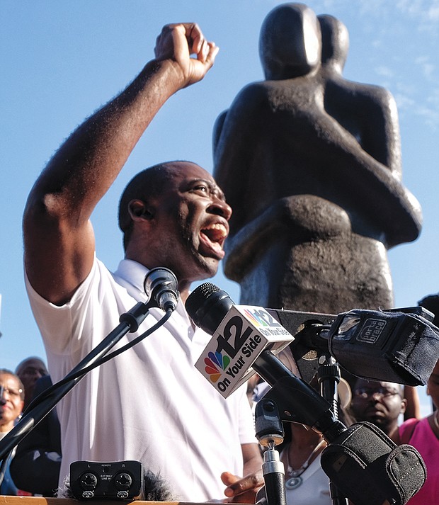 Reconciliation rally // Richmond Mayor Levar M. Stoney addresses a crowd of hundreds Sunday during a solidarity rally at Richmond’s Slavery Reconciliation Statue at 15th and Main streets in Shockoe Bottom. Participants at the hour long vigil remembered the victims of the weekend’s violent clashes in Charlottesville over that city’s planned removal of Confederate statues. They also prayed for President Trump and direction in the ongoing battle against racism and hatred. 