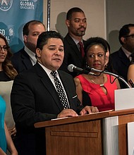 Houston ISD Superintendent Richard A. Carranza surround by school principals and board trustees