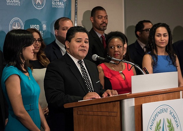 Houston ISD Superintendent Richard A. Carranza surround by school principals and board trustees