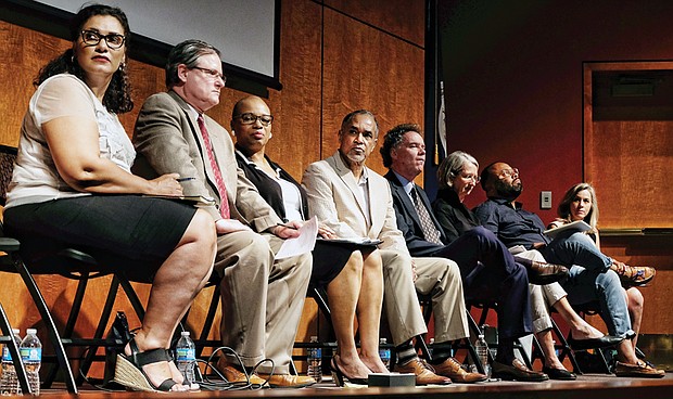 Commission members listen and take notes during the first public hearing Aug. 9. They are, from left, Kim Gray, Co-chair Gregg Kimball, Lauranett Lee, Stacy Burrs, Ed Ayers, Sarah Driggs, Julian Hayter and Coleen Butler Rodriguez. 