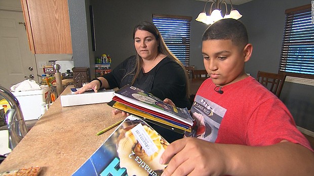 Meredith Stroud's son, LJ, was born with cleft lip and palate. He lost his Children's Medical Service coverage when he was 11./CNN
