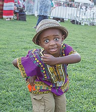 Down home groove //
Cairo Kelly, 2, dances to the music at the Down Home Family Reunion last Saturday at Abner Clay Park in Jackson Ward. This was the 27th year for the annual festival that seeks to demonstrate how African heritage has influenced the American South by sharing experiences and traditions through food, storytelling, music, art and a marketplace. Please see more photos on B2.