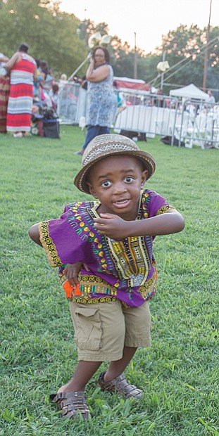 Down home groove //
Cairo Kelly, 2, dances to the music at the Down Home Family Reunion last Saturday at Abner Clay Park in Jackson Ward. This was the 27th year for the annual festival that seeks to demonstrate how African heritage has influenced the American South by sharing experiences and traditions through food, storytelling, music, art and a marketplace. Please see more photos on B2.