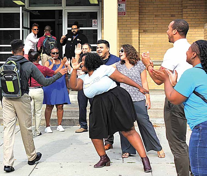 Staff members of the Noble Network of Charter Schools join elected officials and community members in welcoming freshmen students.