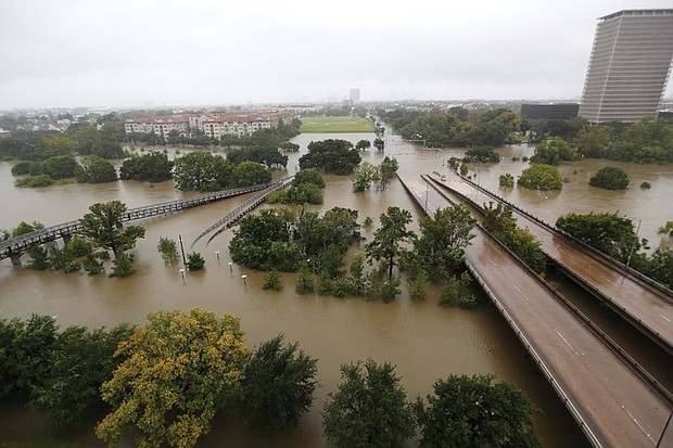 Hurricane Harvey pours over Texas // An overhead view of the flooding in Houston from Buffalo Bayou on Memorial Drive and Allen Parkway as heavy rain continues to fall on the city Monday.