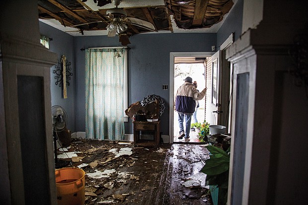 Lucas Garcia walks out of his home Saturday in Refugio, Texas, where he and other family members rode out Hurricane Harvey in one room.
