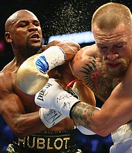 Boxer Floyd Mayweather Jr., left, lands a punch on Conor McGregor, a mixed martial arts champion, during last Saturday’s boxing match at the T-Mobile Arena in Las Vegas.
