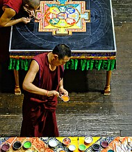 Sands of Tibetan time //
Tibetan monks from the Drepung Loseling Monastery in Brookhaven, Ga., create a sand mandala during a five-day process in mid-August at the Virginia Holocaust Museum in Downtown.