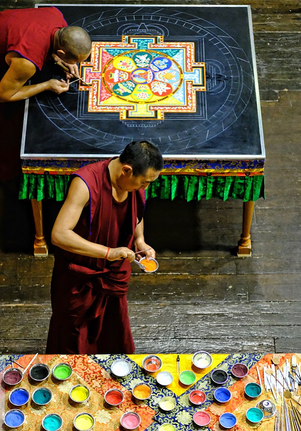 Sands of Tibetan time //
Tibetan monks from the Drepung Loseling Monastery in Brookhaven, Ga., create a sand mandala during a five-day process in mid-August at the Virginia Holocaust Museum in Downtown.