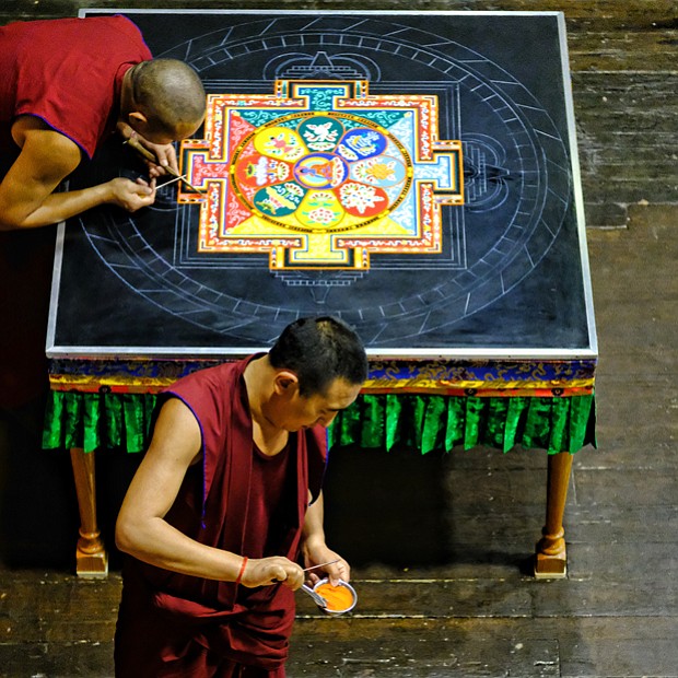 Sands of Tibetan time //
Tibetan monks from the Drepung Loseling Monastery in Brookhaven, Ga., create a sand mandala during a five-day process in mid-August at the Virginia Holocaust Museum in Downtown.