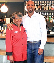 Restaurateurs Velma R. Johnson, owner of Mama J’s Kitchen in Jackson Ward, and her son, Lester Johnson, new owner of Vagabond at 700 E. Broad St., pause as they prepare for Vagabond’s reopening Friday, Sept. 1 during First Fridays. 
