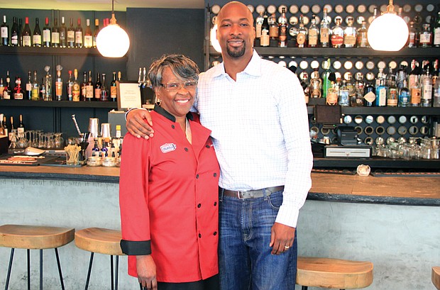 Restaurateurs Velma R. Johnson, owner of Mama J’s Kitchen in Jackson Ward, and her son, Lester Johnson, new owner of Vagabond at 700 E. Broad St., pause as they prepare for Vagabond’s reopening Friday, Sept. 1 during First Fridays. 
