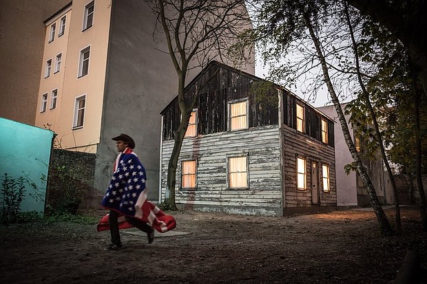 Ryan Mendoza, an American artist, in front of the exhibit he made in Berlin of the Rosa Parks house. (photo: Gordon Welters/NY TIMES)