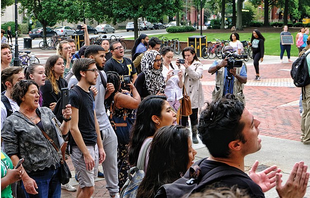 Students at Virginia Commonwealth University and their allies hold a rally Wednesday seeking continued university support for DACA students. VCU President Michael Rao pledged his support for the program and to keep Dreamers at the university. 