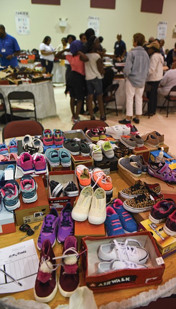 Volunteers also were on hand Monday to help youngsters make shoe selections at the program’s second location at New Deliverance Evangelistic Church Annex on Turner Road.