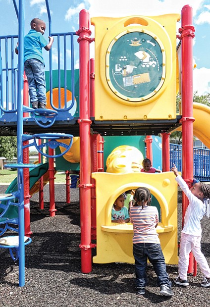Child’s play // 
Children in the Overby-Sheppard Elementary VPI-Pre K program enjoy the playground equipment at their temporary home at Clark Springs Elementary in the city’s Randolph neighborhood. Overby-Sheppard is undergoing renovations, with the students expected to return in January.
