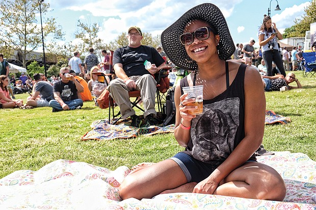 Stephanie Williams, right, enjoys a drink in the sunshine during the daylong event featuring six bands.
The City of Richmond put up more than $20 million to help attract and build the brewery in Fulton Bottom.