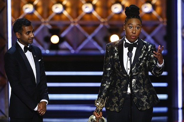 Lena Waithe accepts the Emmy Award for Outstanding Writing for a Comedy Series at the 69th Primetime Emmy Awards, Sunday, September 17, 2017. She is the first African American woman to win an Emmy for comedy writing.