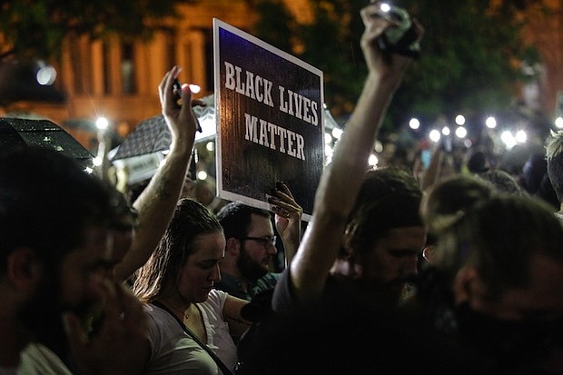 Dozens of people were arrested after a forth night of demonstrations in St. Louis over the acquittal of former police officer Jason Stockley who had been charged with first-degree murder.  Credit: Lawrence Bryant/St. Louis American