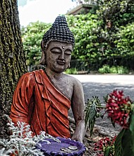 Cityscape // Nestled among plantings on 9th Street amid the noise and traffic outside the gates of the Capitol in Downtown, this Buddhist statue offers passers-by a peaceful pause. Garbed like a monk, the statue holds a donation plate. This is an example of Bodhisattva art. Bodhisattva is a Sanskrit term and describes a person who is on the path to enlightenment as outlined by the religion’s founder, Gautama Buddha. The statue recently was removed.
