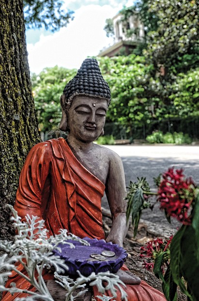Cityscape // Nestled among plantings on 9th Street amid the noise and traffic outside the gates of the Capitol in Downtown, this Buddhist statue offers passers-by a peaceful pause. Garbed like a monk, the statue holds a donation plate. This is an example of Bodhisattva art. Bodhisattva is a Sanskrit term and describes a person who is on the path to enlightenment as outlined by the religion’s founder, Gautama Buddha. The statue recently was removed.
