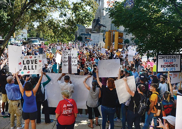 Breaking barriers of hate // Clement Britt
Hundreds of counterprotesters hold signs in front of the Confederate J.E.B. Stuart statue at Monument Avenue and Lombardy Street after holding an early morning rally for racial justice at the Maggie L. Walker statue in Downtown and marching to Monument Avenue.
