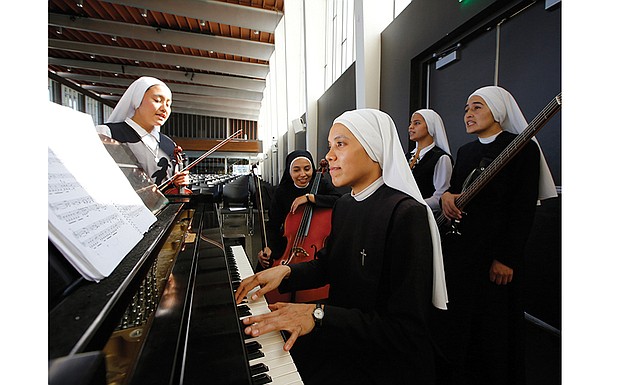  Members of Siervas, a Peruvian-based rock ‘n’ roll band composed entirely of Catholic nuns, rehearse on Sept. 7, a day ahead of their performance at the Christ Cathedral campus in Garden Grove, Calif. The sisters insist they aren’t rock stars though they’re being considered for a nomination for a Latin Grammy and their concerts draw thousands.