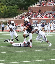 University of Richmond wide receiver Tyler Wilkins carries the ball past the Howard University defense during last Saturday’s blowout at Robins Stadium on the UR campus.