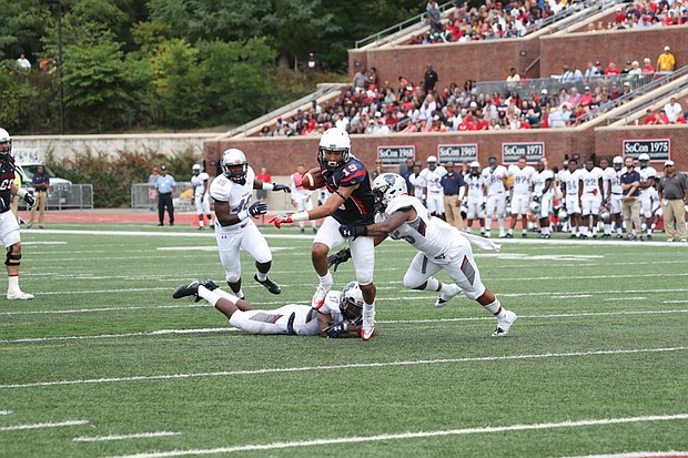 University of Richmond wide receiver Tyler Wilkins carries the ball past the Howard University defense during last Saturday’s blowout at Robins Stadium on the UR campus.