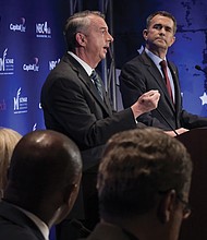 Republican gubernatorial candidate Ed Gillespie makes a point while Democratic Lt. Gov. Ralph Northam listens during Tuesday night’s gubernatorial debate in Northern Virginia.