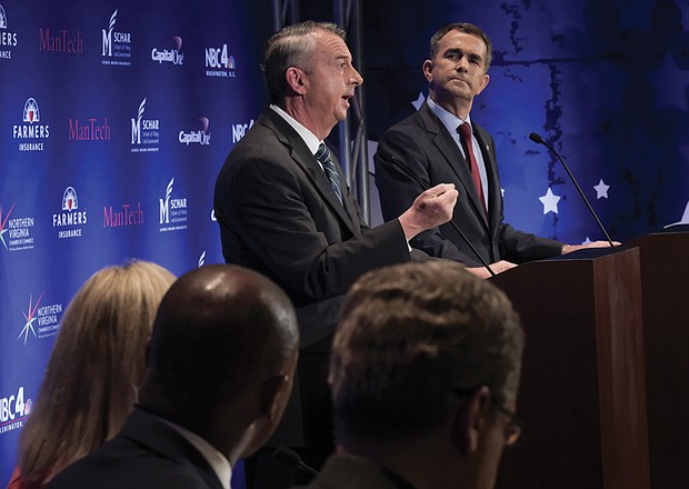 Republican gubernatorial candidate Ed Gillespie makes a point while Democratic Lt. Gov. Ralph Northam listens during Tuesday night’s gubernatorial debate in Northern Virginia.